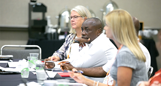 APWA committee members discuss public works issues at a meeting